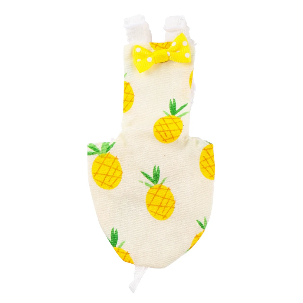 A reusable parrot-themed diaper with a yellow bow and fruit print.