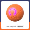 An orange interactive pet jump ball with a glowing purple switch on top.