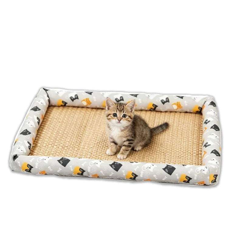 A small tabby kitten is resting on a rectangular, light beige rattan pet bed with a patterned fabric mat.