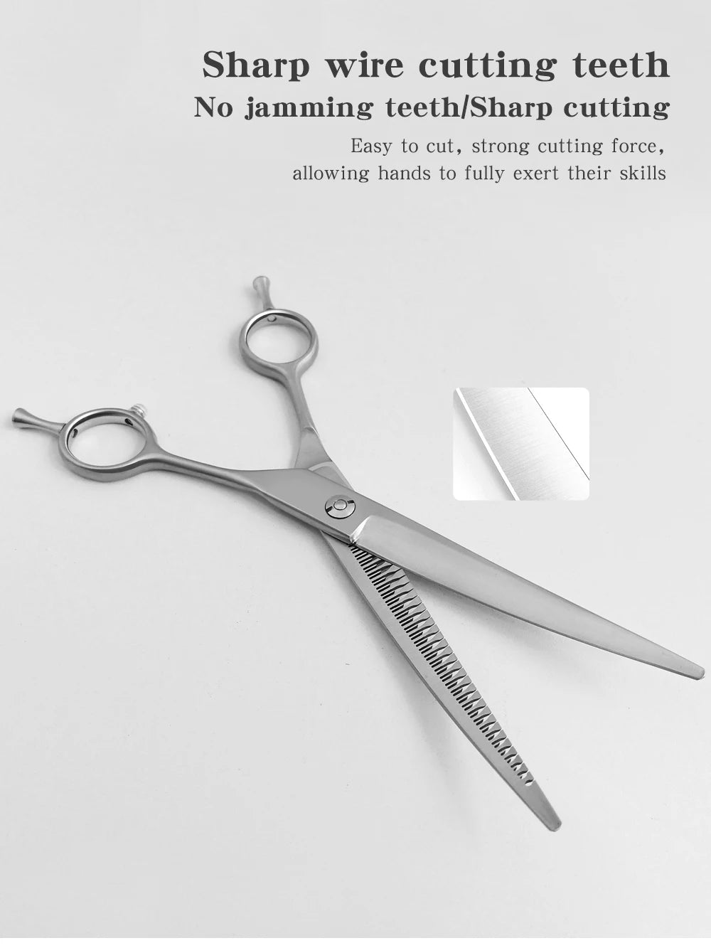 Silver professional pet grooming shears with sharp cutting teeth shown against a white background.