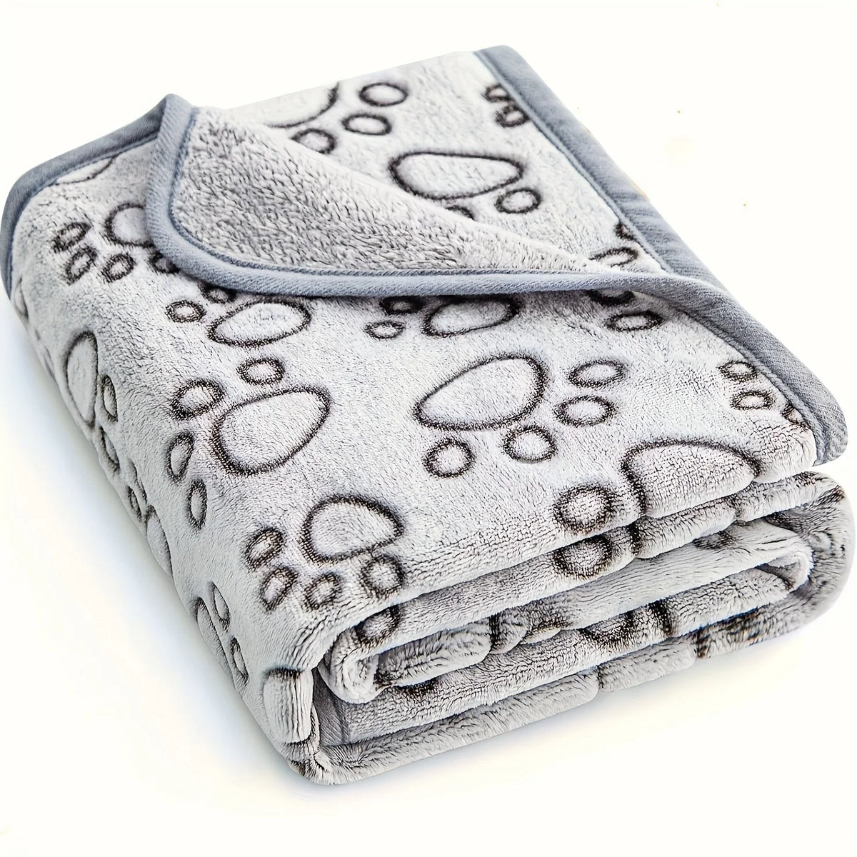 A stack of soft gray pet blankets featuring a paw print pattern.