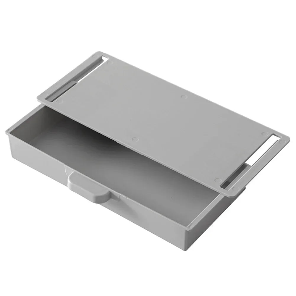 A gray under desk drawer organizer with a hinged dust-proof cover shown from above.