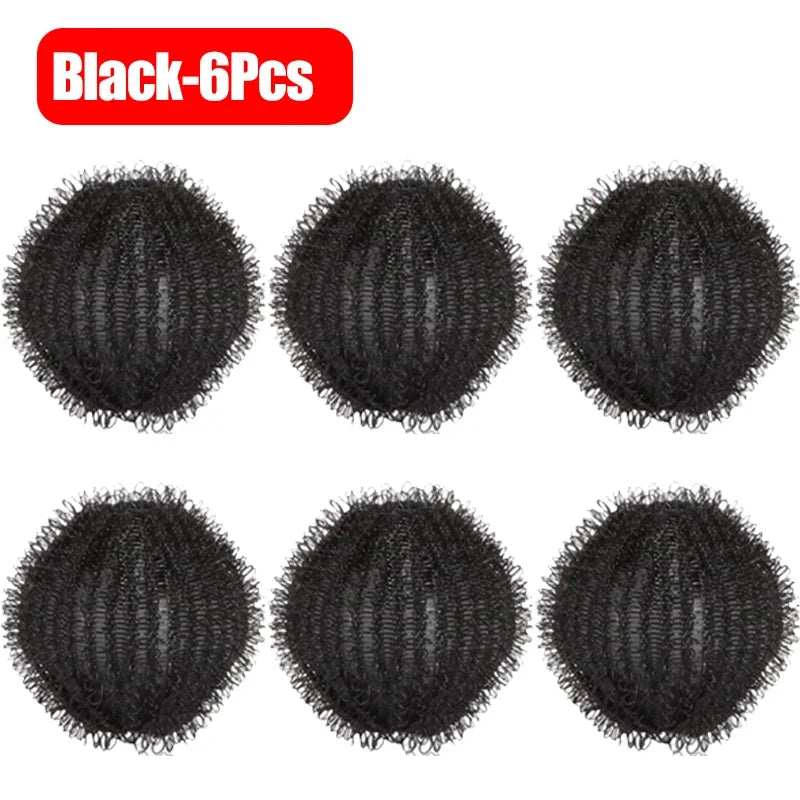 Six black reusable lint filter balls used for laundry