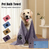 A golden retriever dog is shown next to a purple pet bath towel and several small paw print fabric squares.