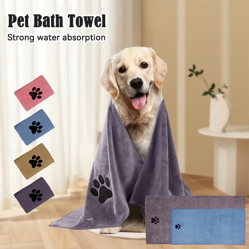 A golden retriever dog is shown next to a purple pet bath towel and several small paw print fabric squares.