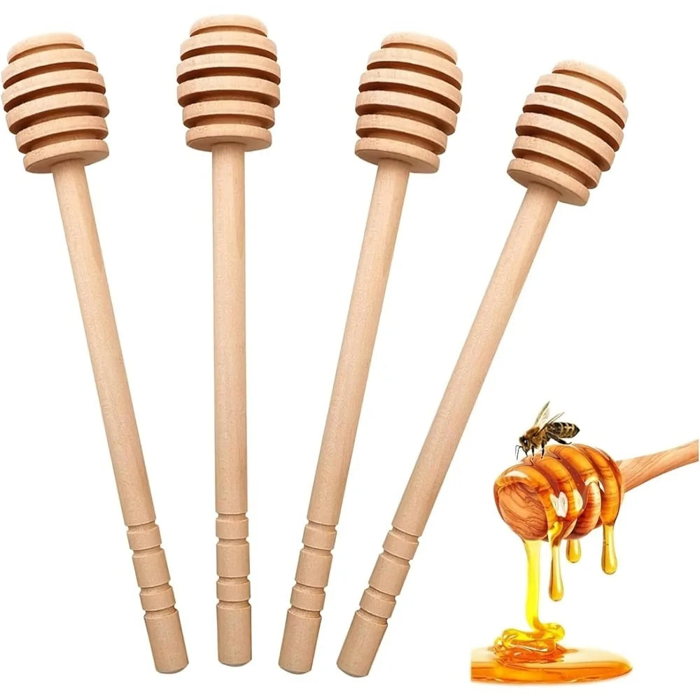 A set of eight wooden honey dipper stirring sticks and a dripping jar of golden honey.