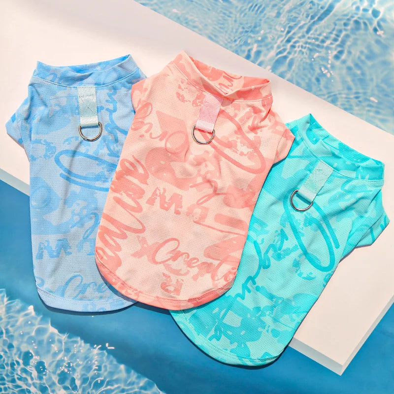 Three brightly colored ice silk cooling vests for dogs and cats in blue, pink, and turquoise.