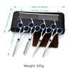 A set of professional stainless steel pet grooming scissors and a comb displayed on a black background.