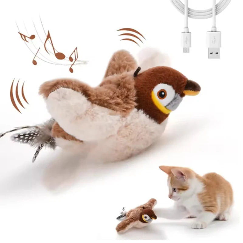 Un jouet d'oiseau en peluche interactif à côté d'un petit chaton.