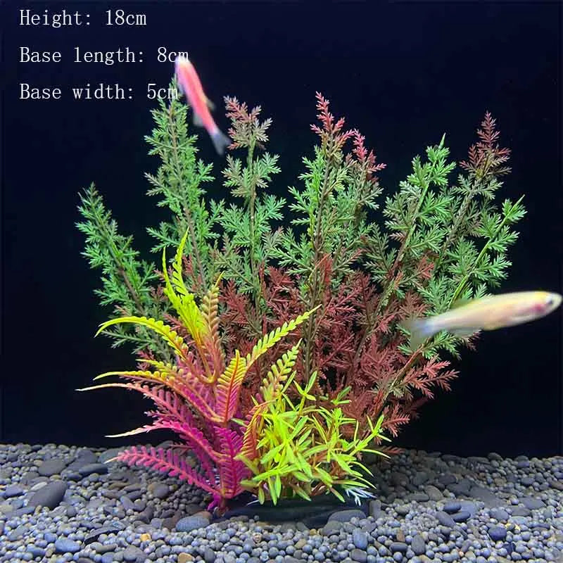 A realistic artificial aquarium plant with green and red foliage is displayed in a gravel substrate.
