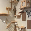Wall-mounted wooden cat climbing hammock made of light wood planks and branches.