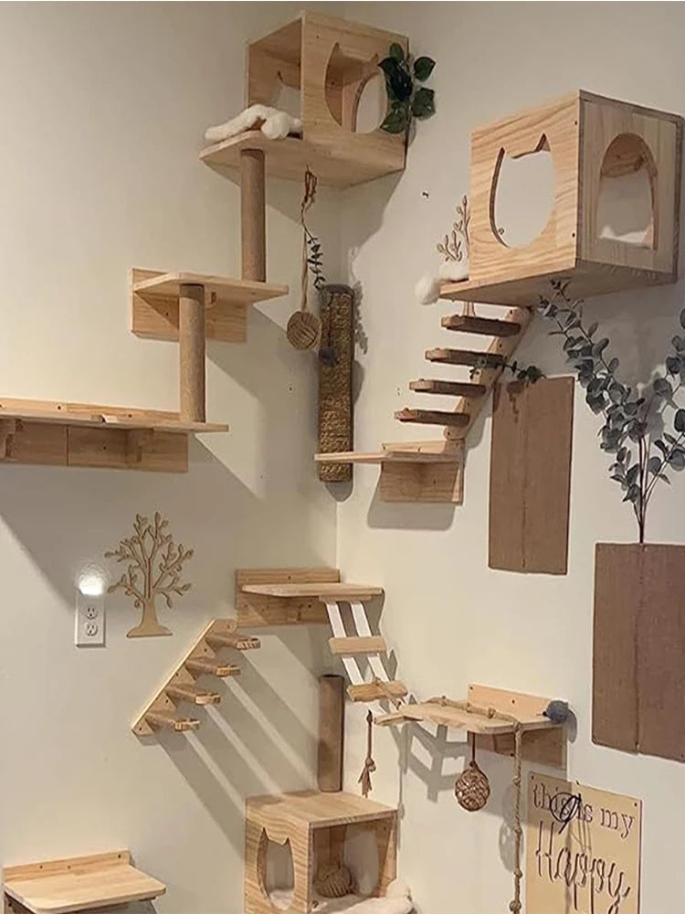 Wall-mounted wooden cat climbing hammock made of light wood planks and branches.