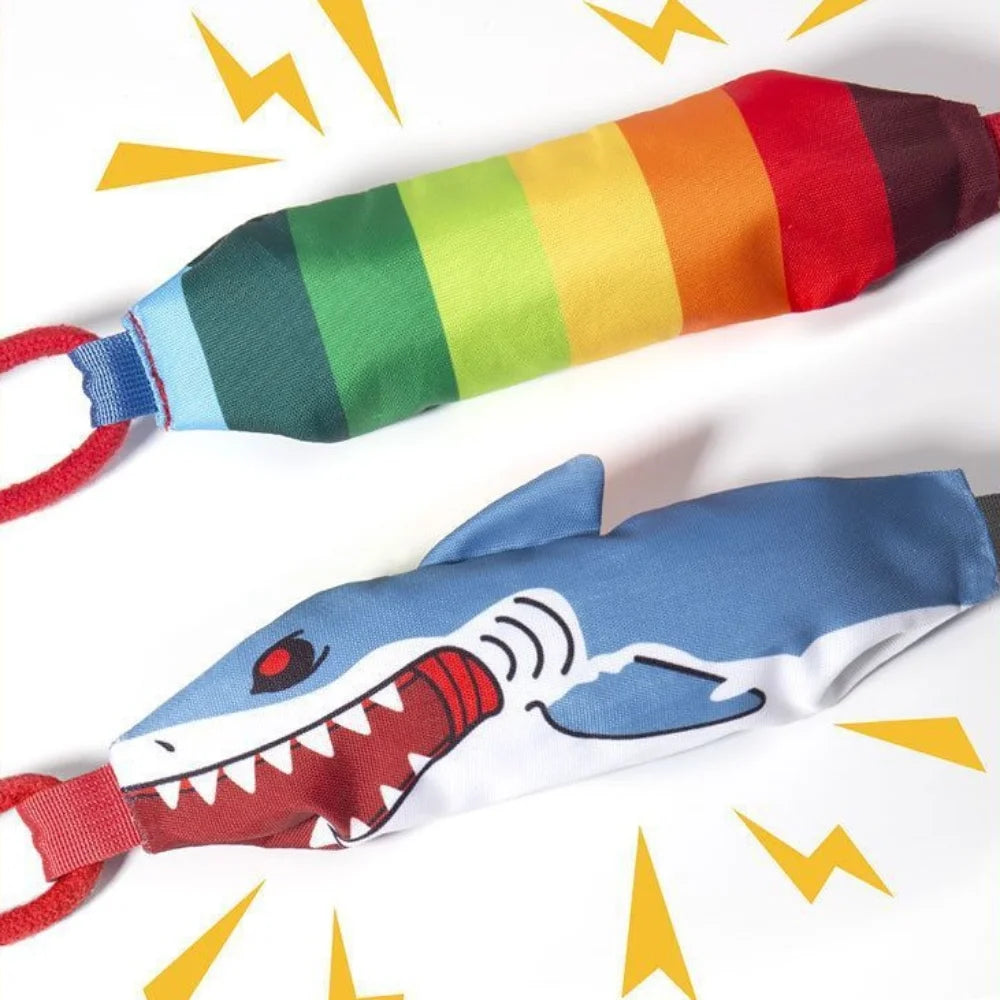 A colorful rope toy featuring a shark design and suction cup for dogs.