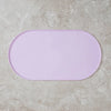 A smooth, oval-shaped, light purple non-slip feeding mat for pets.