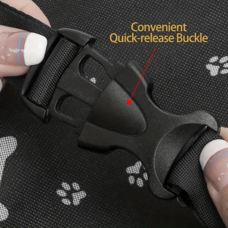 A close-up of a black pet travel booster seat with a convenient quick-release buckle for dogs and cats.