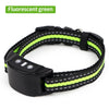 Black wristband training device with fluorescent green accents and a black casing.