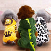 Three plush cartoon animal pet costumes featuring a lion, a brown furry creature, and a black and white spotted animal.