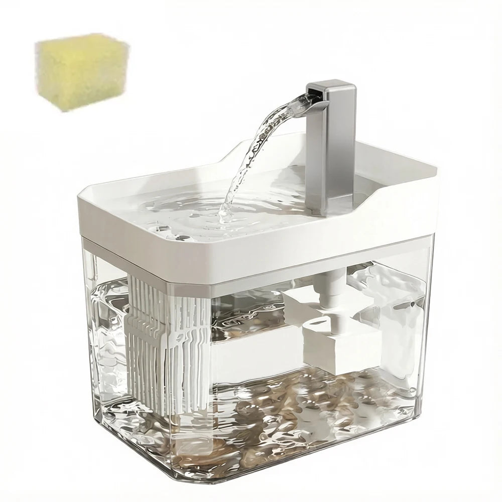 A clear water fountain with a recirculating pump and filter is shown, featuring a white base and a stream of water.