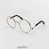 Goldgerahmte Brille mit schwarzen Schläfen
