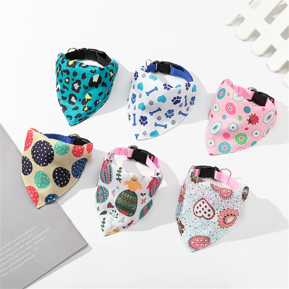 A collection of colorful patterned triangle collar bandanas for small dogs and cats.