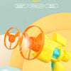 Hand-held flying sky bamboo dragonfly toy launcher in yellow and orange with replacement discs