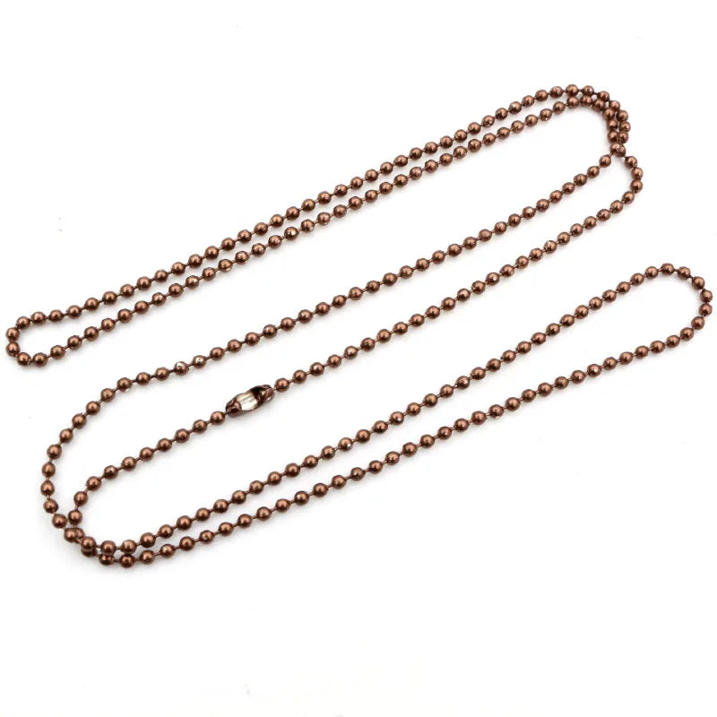 A set of ball necklaces plated in gold and silver metal.