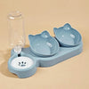 Ein hellblauer Napf-Set für Haustiere mit Wasserabgießer und separate Essschale.
