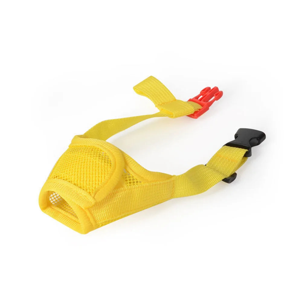Yellow adjustable breathable dog muzzle with a red clip and black strap.