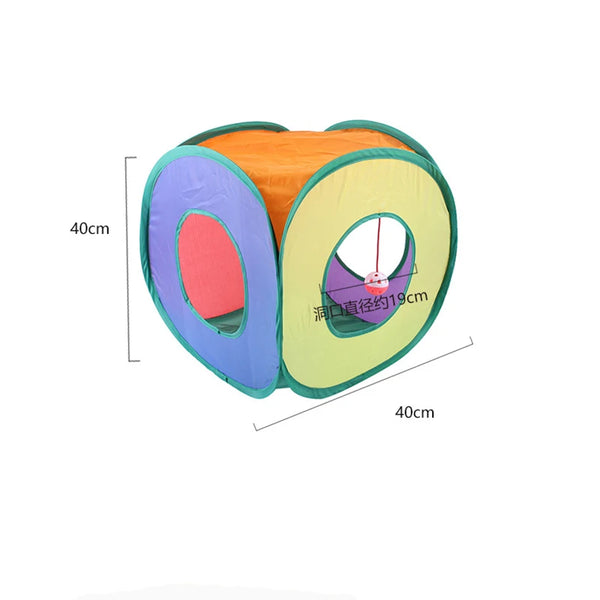 An orange, purple, and green fabric tunnel toy set with a feather wand visible from above.