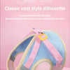 Pink and blue classic vest style dog harness shown against a pink background.