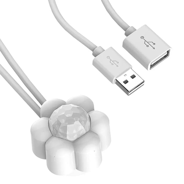 A white smart pet water dispenser with a motion sensor and flexible tubing.
