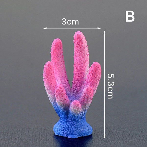 A pink and blue artificial coral reef decoration shaped like a starfish, shown from the top.
