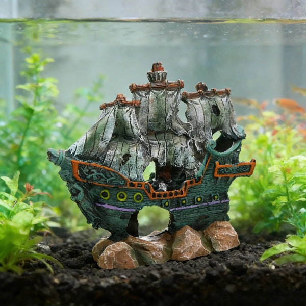Resin shipwreck aquarium decor featuring a wooden ship with masts and a hideout structure.