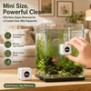 A hand holds a white Mini magnetic aquarium glass cleaner device with green aquatic plants inside a clear glass aquarium.