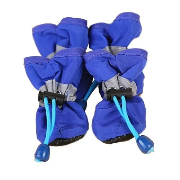 A pair of royal blue cozy anti-slip dog boots for paws.