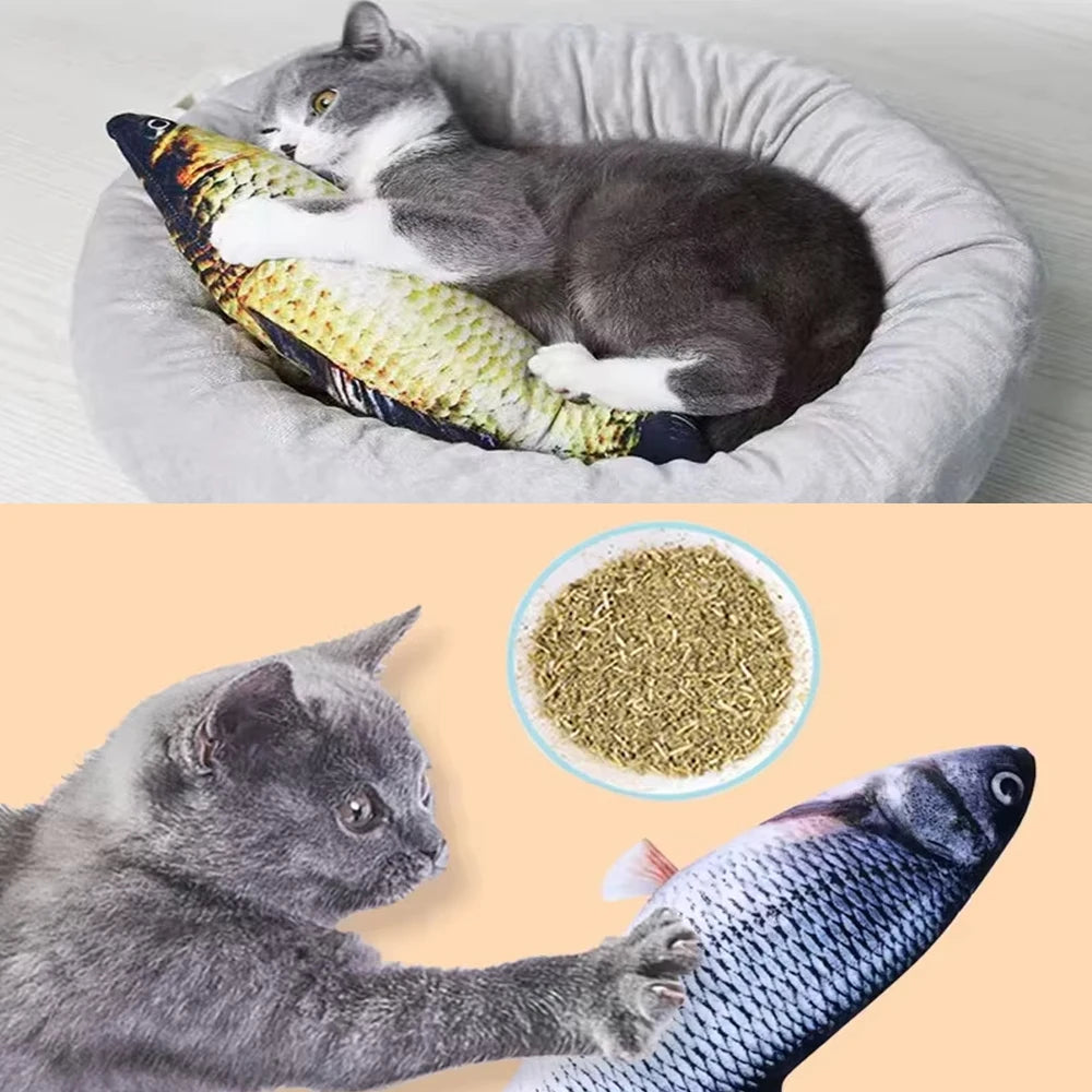 A gray kitten is interacting with a fish-shaped plush toy in a gray bowl.