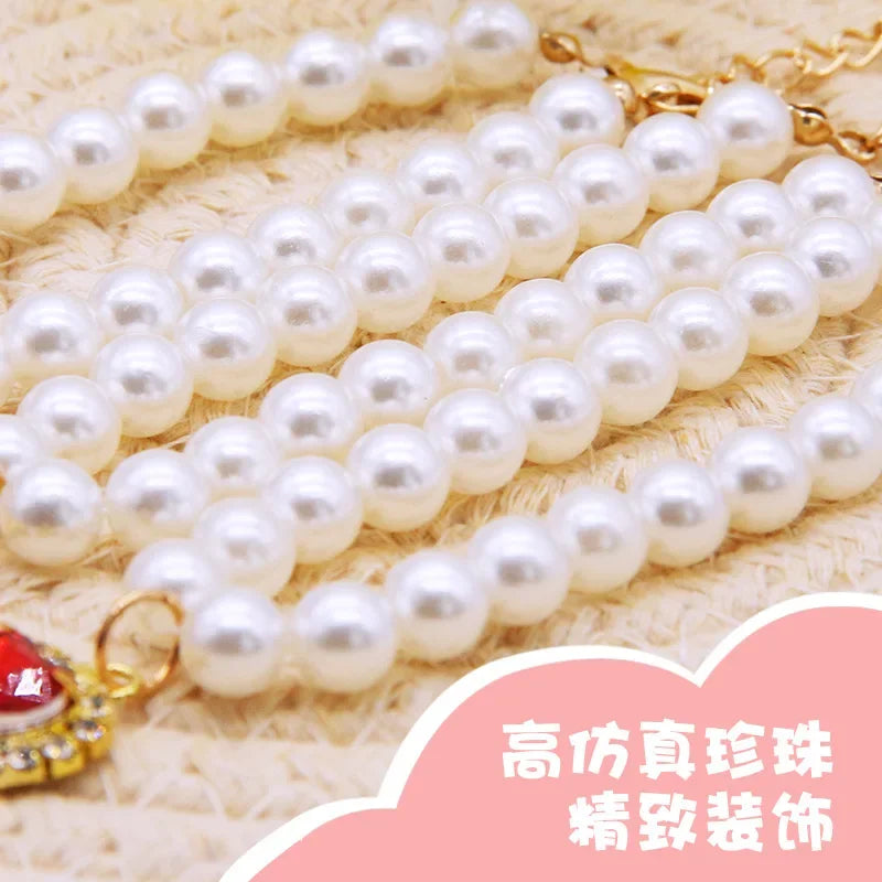 A string of white pearls is displayed on a beige background, with an adjustable collar visible at the end.