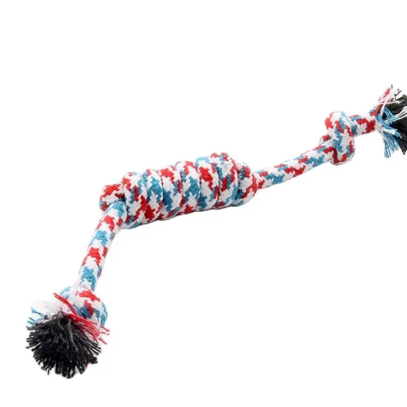 A braided cotton rope chew toy for dogs featuring red, white, and blue patterned fibers.
