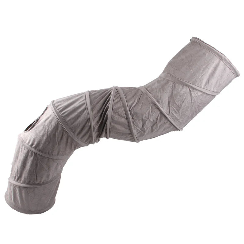 A gray foldable S-shape cat tunnel with a suede finish.