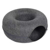 A round, gray cat bed with an interactive play tube entrance.