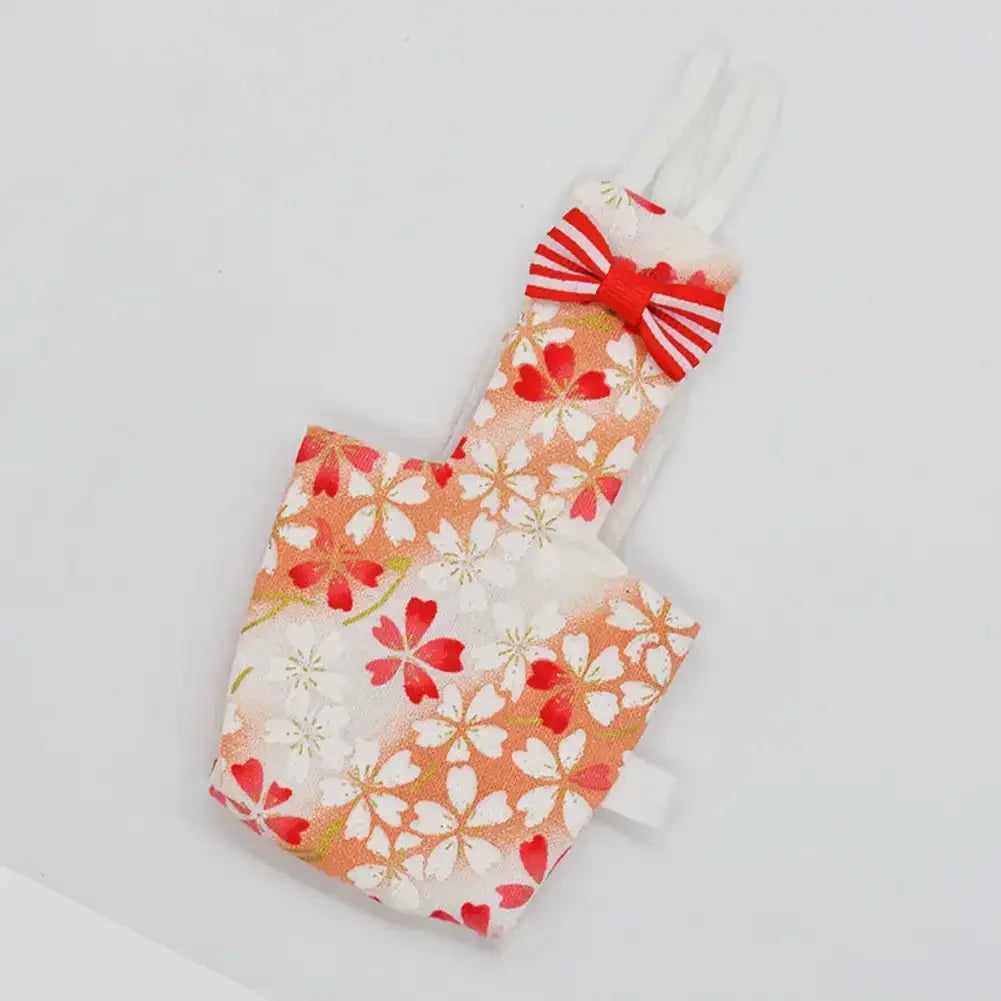 Floral parrot diaper flight suit with a red bow tie