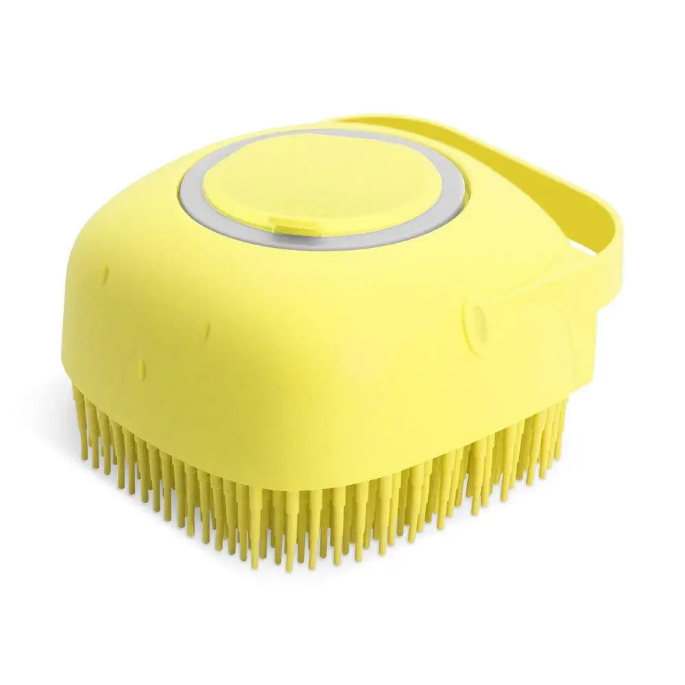 A yellow silicone pet shampoo brush and grooming comb with a rounded head and numerous bristles.