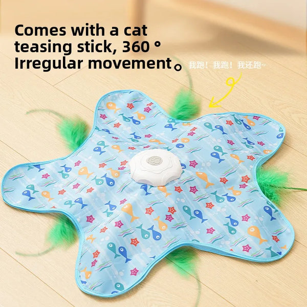 A light blue interactive cat teasing stick toy with a white ball and green feathers on a wooden surface.