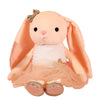 A soft peach colored plush rabbit toy with large ears and a sheer pink tutu skirt.