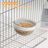 Grey Starry Sky Cup bird feeder with a transparent window hanging in a wire mesh cage