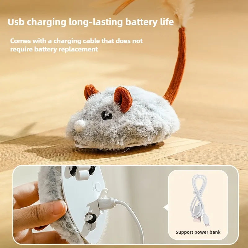 A fluffy gray cat toy mouse with orange ears is shown next to a hand holding the USB charging cable.