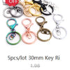 A set of five gold and silver plated key rings or ball necklaces for sale.