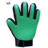 A green silicone pet grooming glove with a black cuff and textured fingertips.