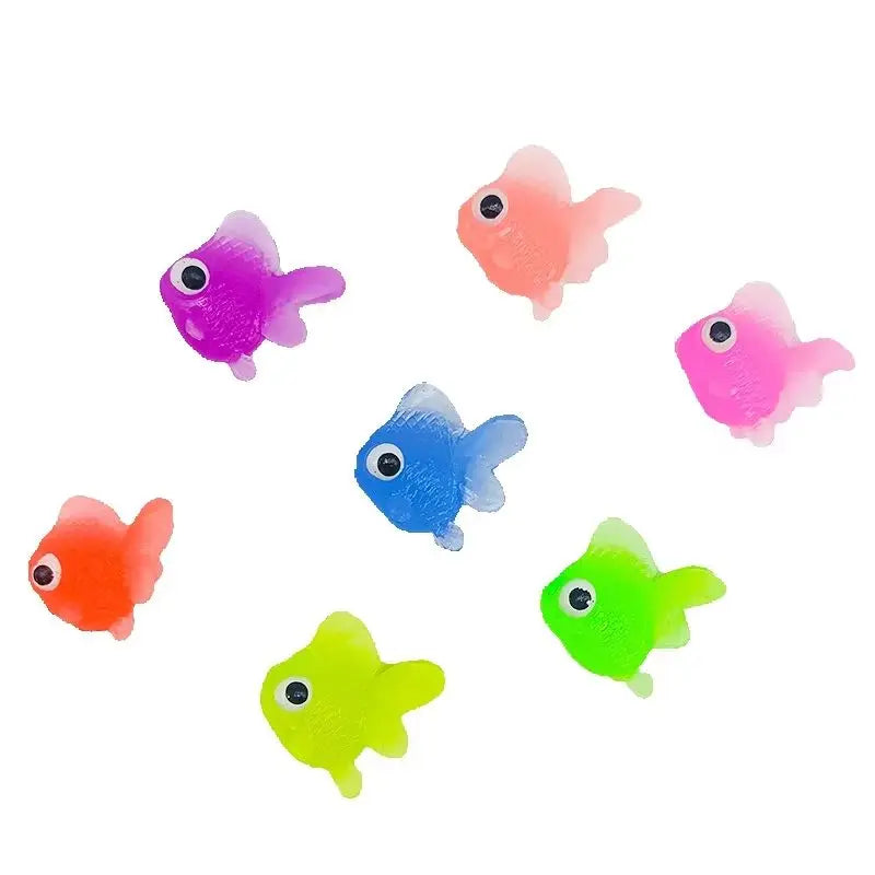 A set of ten soft rubber goldfish bath toys in various bright colors including pink, purple, blue, and green.