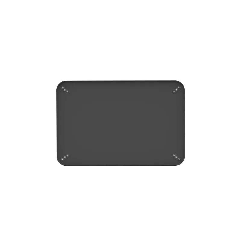 A gray silicone dog pee pad holder with raised edges.